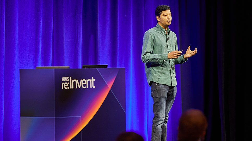 A presenter on stage at re:Invent